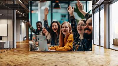 Group of happy young business people in smart casual wear having fun while working in creative office. Wall mural