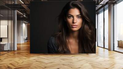 Portrait of a beautiful brunette woman on a dark background. Wall mural