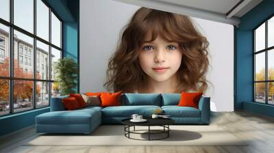 Portrait of a cute little girl with long curly hair. Studio shot. Wall mural