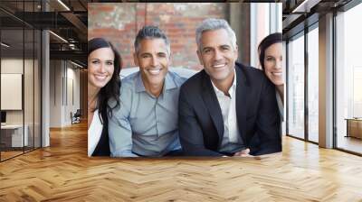 Portrait of happy business team looking at camera and smiling in office Wall mural