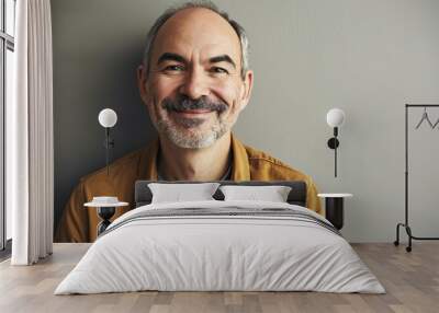 Portrait of happy senior man with grey hair and beard smiling at camera Wall mural