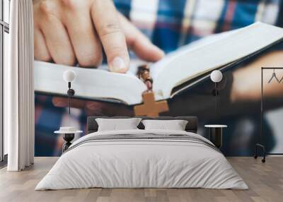 Man holding and reading the holy Christian Bible Wall mural