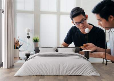 Young men studying for a test or an exam. Wall mural