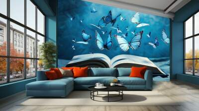 World book day. An open book with a fantasy background and butterflies flying around, light blue background. International literacy day. Reading book. Back to school. Happy Book Day. Copy space area Wall mural