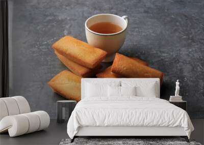 Delicious French Financiers Cake  with Fresh Butter, Served with Tea. Copy Space for Text. On Grey Cement Background Wall mural