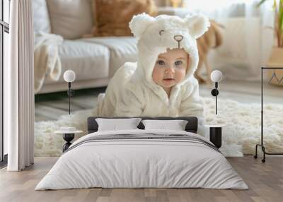 A baby dressed in a cute animal costume Wall mural