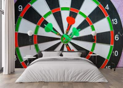 Darts at dartboard bulls eye Wall mural