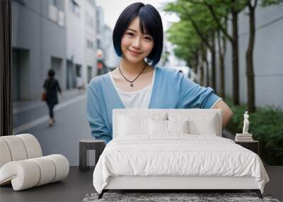 portrait of beautiful woman with short hair, wearing a light blue sweater, urban background Wall mural