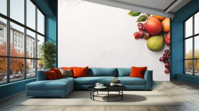 A colorful assortment of fresh fruits arranged on a marble surface. Wall mural