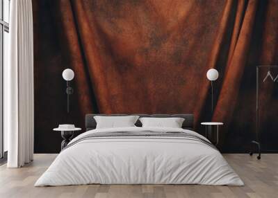 A textured brown fabric draped elegantly, creating a warm and inviting backdrop. Wall mural