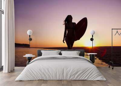 Portrait of a teenage girl in the beach sitting on the sand  Wall mural