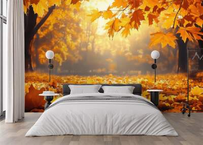 Orange maple leaves on the ground with a bokeh effect defocused background Wall mural