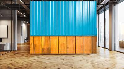 A contrast of two different types of wall material; the aqua, shiny, smooth corrugated aluminium sheeting at the top against the natural, rough uneven texture of the timber planks at the bottom. Wall mural