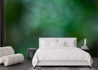 Abstract green light effects to create blurred bokeh background. Wall mural