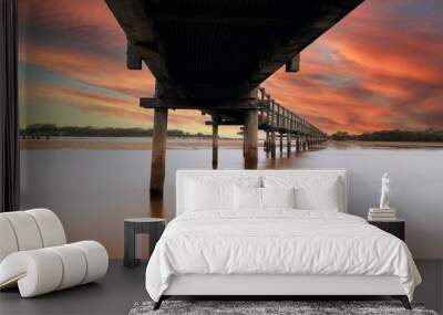 Beautiful view of boardwalk over water surface and reflecting on evening sunlight background. Relaxing and Holiday concept. Wall mural