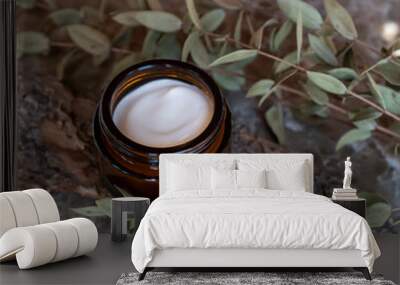 Face or body cream in dark glass jar with natural extracts and oils. Skin care cosmetics. Herbal treatment Wall mural