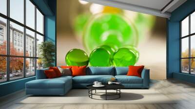 Abstract composition with beautiful, transparent, round jelly balls on an aluminium foil with reflexions and dark background Wall mural