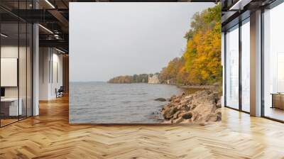 View to the Koknese Castle Ruins and Daugava river with colorful red and yellow trees around in autumn
 Wall mural