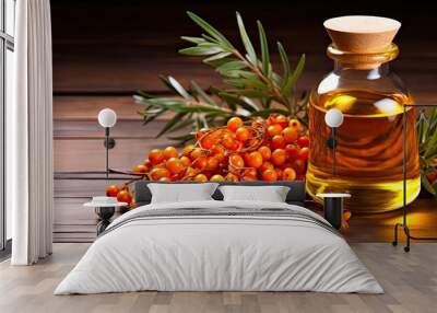 A bottle of sea buckthorn oil near berries Wall mural