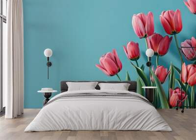 A group of pink tulips against a blue background. Copy space image. Place for adding text and design Wall mural