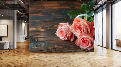 A lovely bouquet of pink roses tied with a white bow for a holiday gift on a dark wooden surface A floral romantic gift for Valentine s Day or a wedding celebration Copy space Wall mural