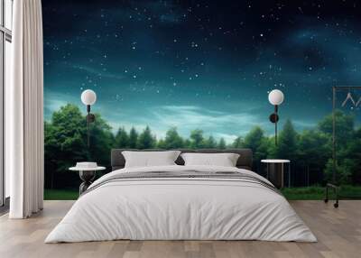 A picturesque landscape of a lush green forest against a clear blue sky with a vast expanse of stars in the background creating a captivating copy space image Wall mural