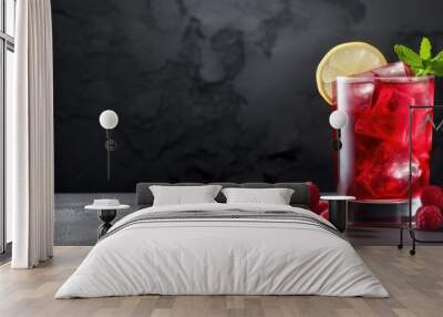 A refreshing red berry summer cocktail adorned with lemon and cherry presented on a stylish gray table background with ample copy space for an image Wall mural