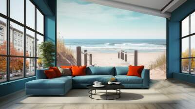 A sandy beach with a wooden path leading to the ocean creating the perfect copy space image Wall mural