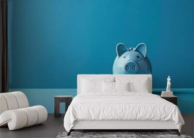 Blue background featuring a concept of a financial crisis with an empty piggy bank providing copy space for additional text Wall mural