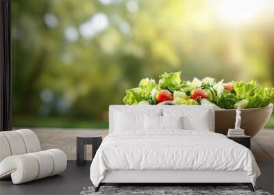 Caesar salad outdoors served on a white wooden table in the garden Copy space image Place for adding text or design Wall mural