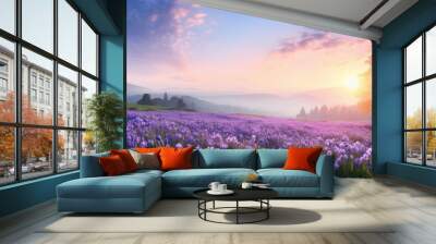 Captivating countryside scene at sunrise with blooming purple flowers in a spring meadow and wildflowers at sunset, creating a serene summer panoramic view with copy space image. Wall mural