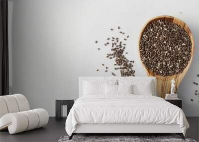 Chia seeds in a wooden spoon set against a white background. Copy space image. Place for adding text and design Wall mural