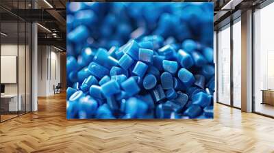 Close-up of blue plastic polymer granules. polymer plastic. compound polymer. PVC resin compounds. Tinted plastic granulate for injection moulding process. Copy space image Wall mural