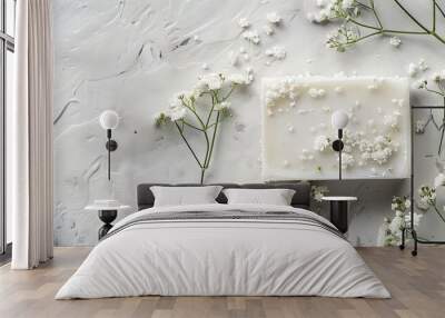 handcrafted soap bar featuring small white flowers on a light gray backdrop top view monochrome image. Copy space image. Place for adding text and design Wall mural