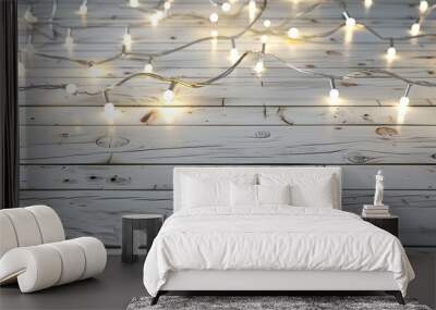 Lovely Christmas lights on a white wooden surface. Copy space image. Place for adding text and design Wall mural