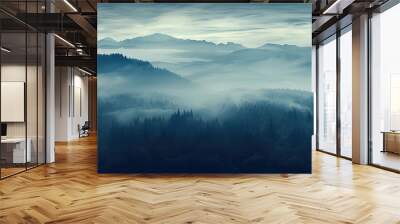 mountains covered in mist under a dark sky Wall mural