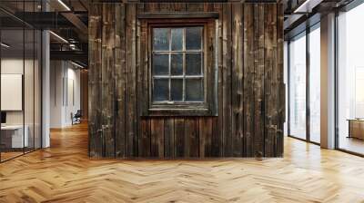 Old farm or village house with a weathered natural wood wall featuring a large window The aged brown wooden planks create a rustic background with a copy space image Wall mural