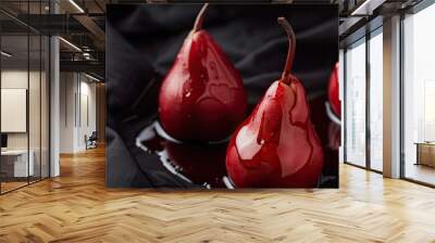 Pears in wine Classic dessert pears cooked in red wine against a black fabric backdrop. Copy space image. Place for adding text and design Wall mural