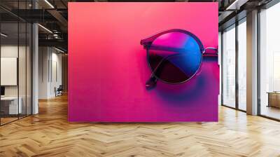 Pink background with vibrant sunglasses copy space image Wall mural