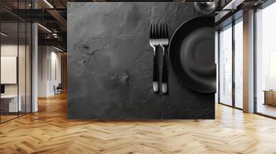 Plate cutlery glass and tablecloth on a black table top view Flat lay Copyspace Wall mural