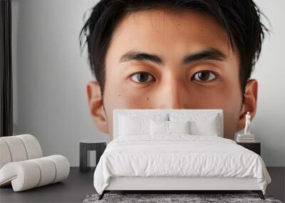 Portrait of a young attractive Asian man Set against a white background with copy space Wall mural