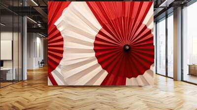 Red Japanese umbrellas with floral designs provide a picturesque copy space image. Wall mural