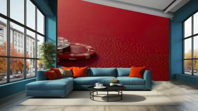 Red table with a group of casino chips in a close up copy space image Wall mural