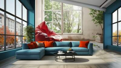 Room with a red bean bag chair next to a window offers a copy space image Wall mural