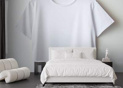 White t shirt hanging on a hook against a white backdrop with copy space image Wall mural