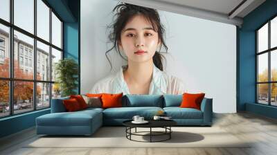 Young Asian woman in pajamas set against a white background. Copy space image. Place for adding text and design Wall mural