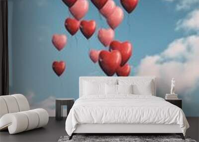 A lot of balloons in red heart shape flying in blue sky. Love and Saint Valentine’s Day concept.  
 Wall mural