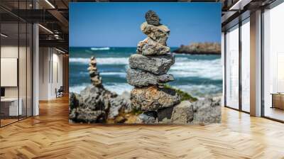 Pyramid of stones  on the sea and sky background Wall mural