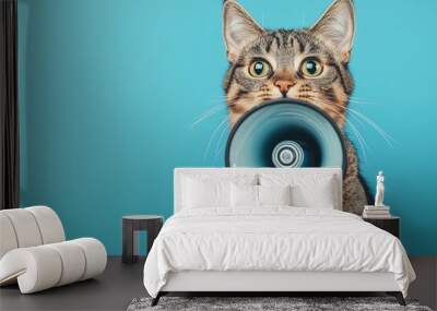 Cat holding a megaphone in its paws and shouting into it, set against a solid background. The scene humorously suggests an announcement of discounts and promotions at a pet store. Wall mural