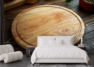 Empty round wooden cutting board on table, food preparation background Wall mural